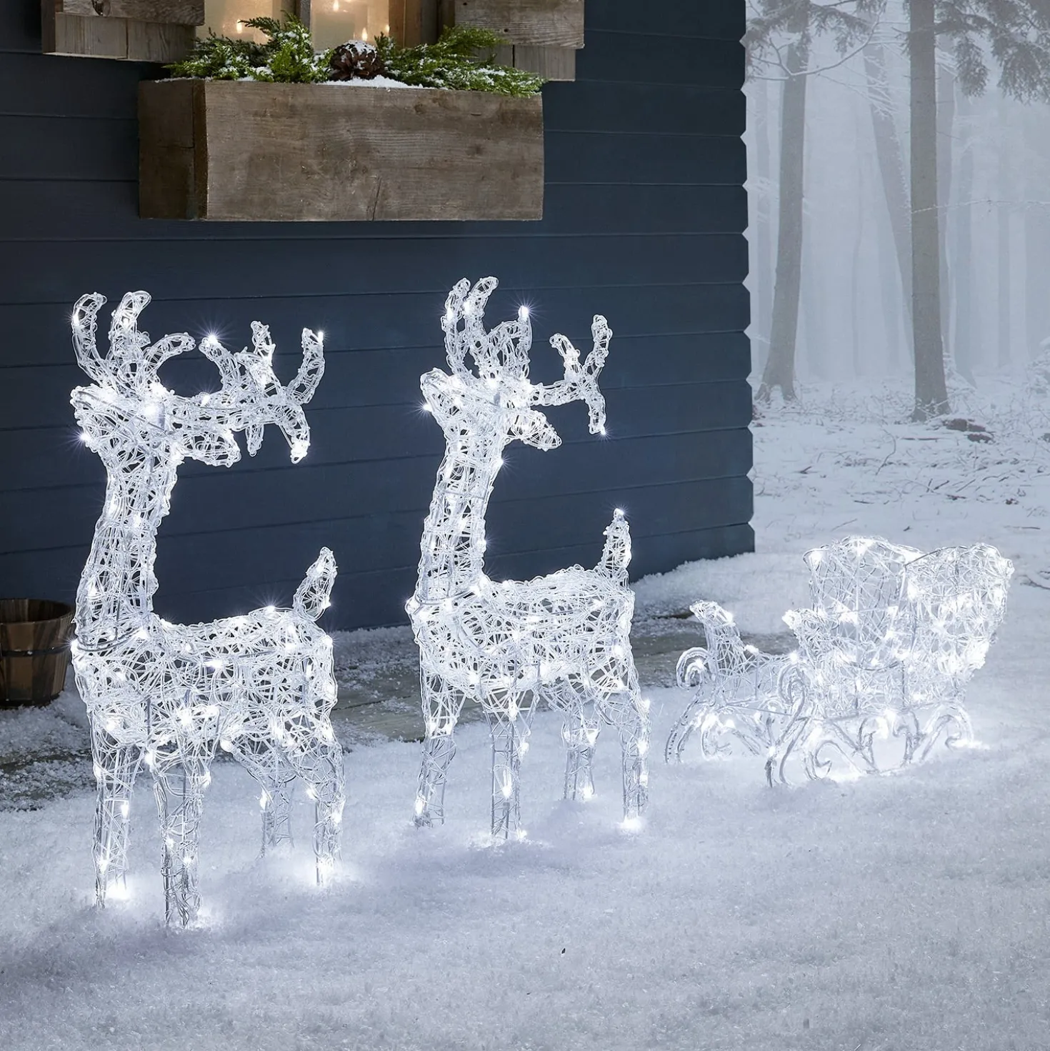 Bicolor LED-Rentiere mit Schlitten Swinsty