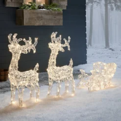 Bicolor LED-Rentiere mit Schlitten Swinsty
