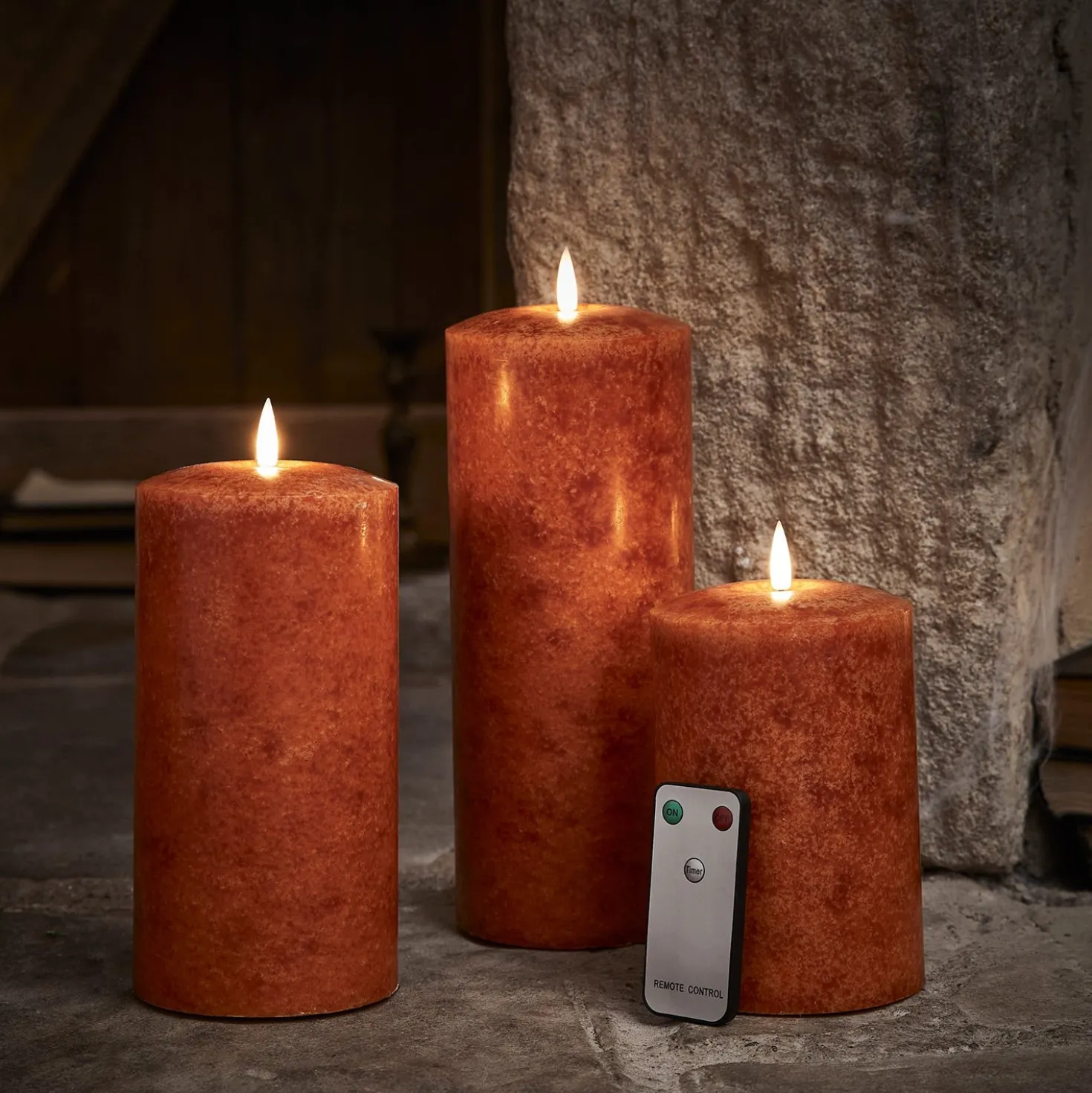 TruGlow® LED Kerzen Echtwachs Trio orange Ø 10cm mit Fernbedienung